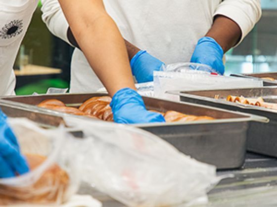 Volunteers preparing sandwiches.