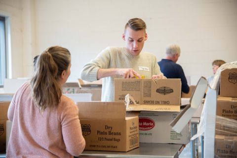 Volunteers unpacking food boxes.